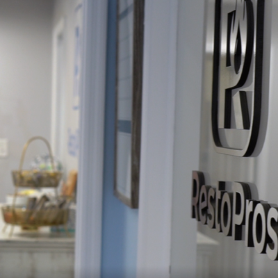 A wall wth the RestoPros logo on it