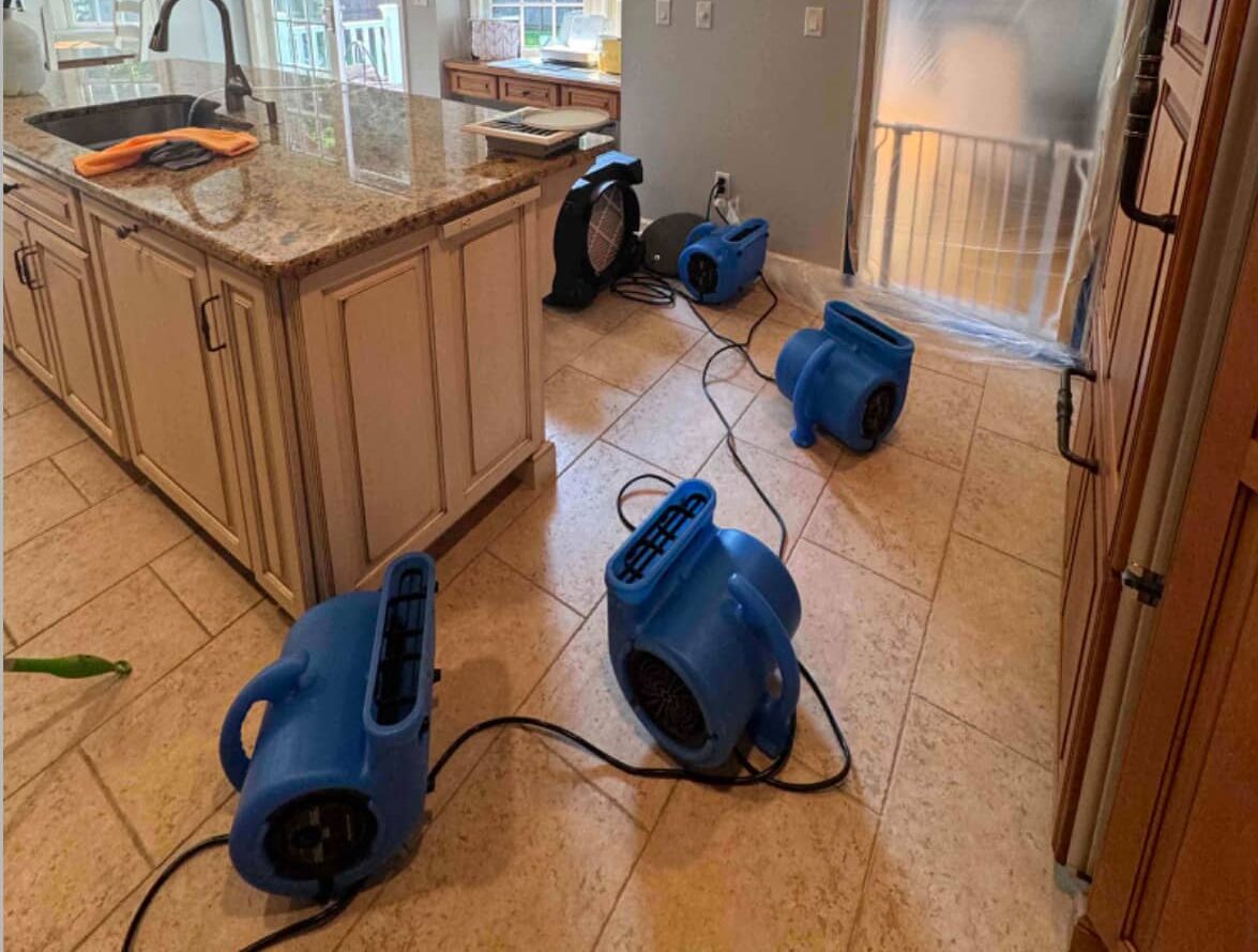 water damage restoration dehumidifiers in a kitchen