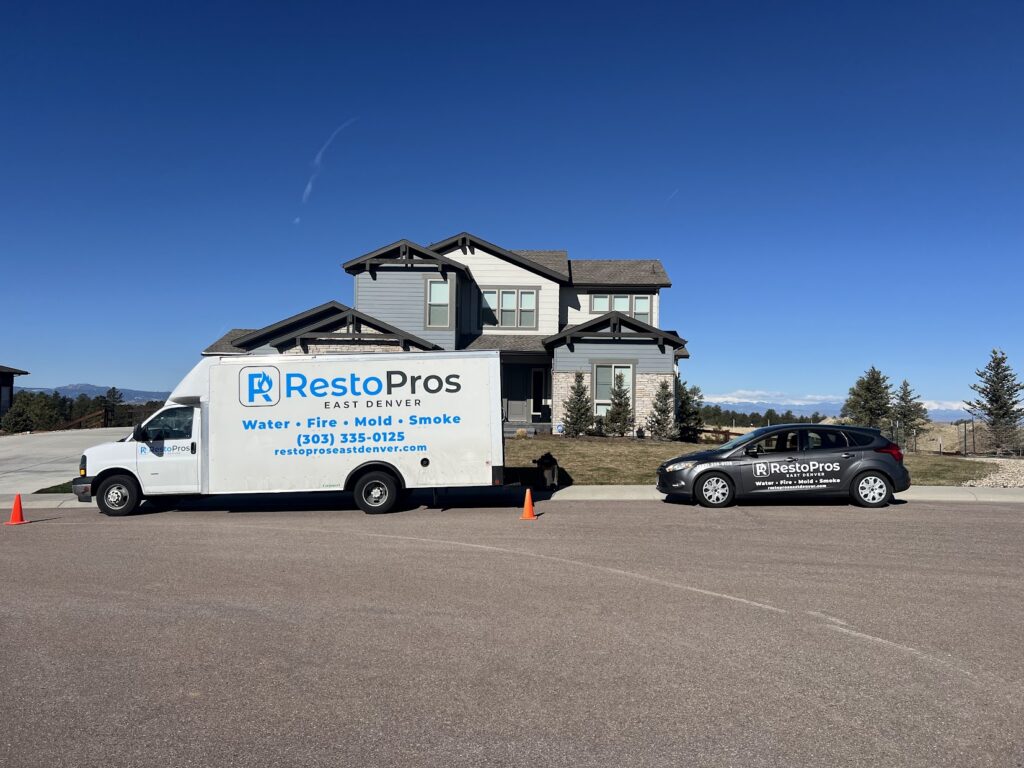 ResoPros East Denver truck and car in front of a house