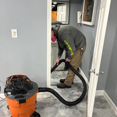 RestoPros worker with vaccuum