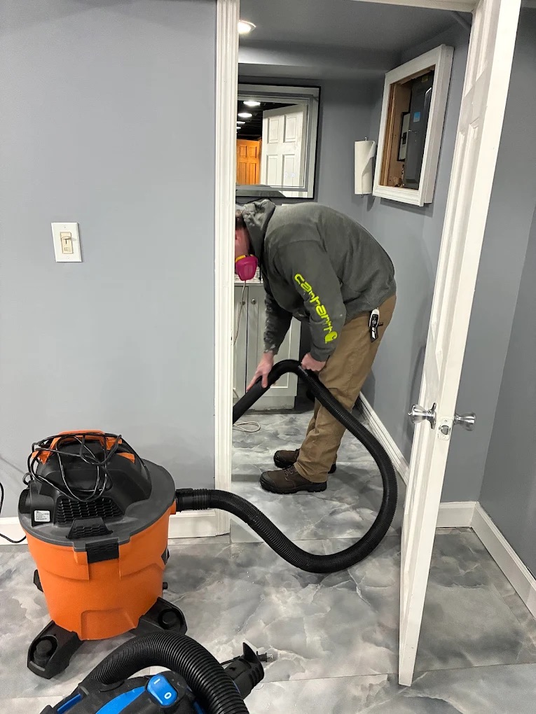 RestoPros worker with vaccuum