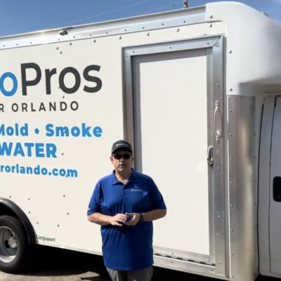 image of owner trigg russell in front of a restopros greater orlando trunk