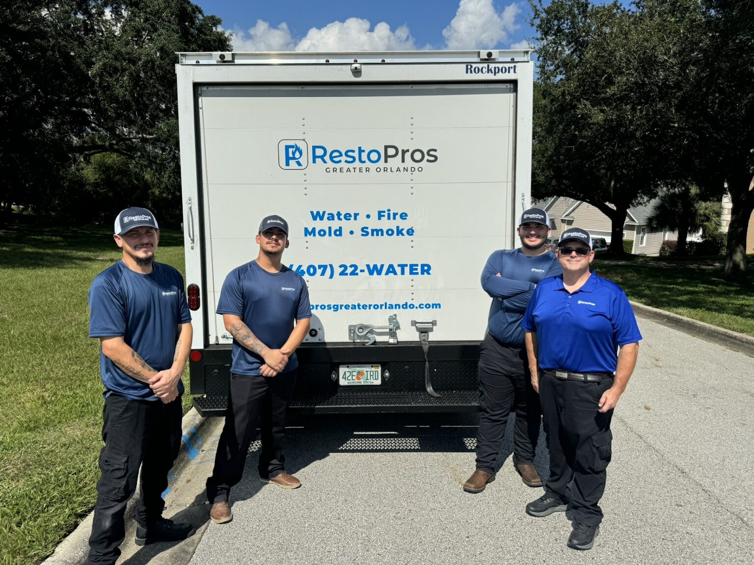 RestoPros Greater Orlando Employees Standing in front of truck.