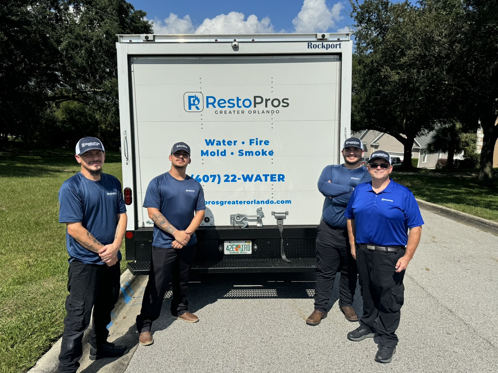 RestoPros Greater Orlando Employees Standing in front of truck.