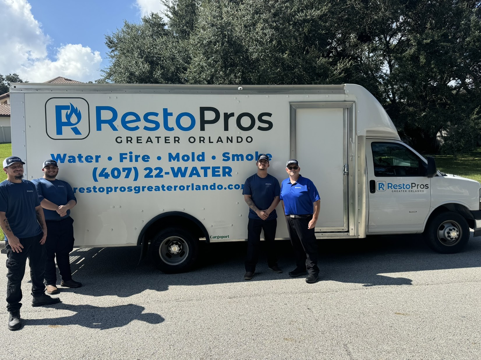 RestoPros Greater Orlando owners in front of truck.