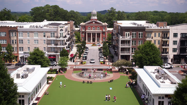 Alpharetta town square with City Hall and people and traffic