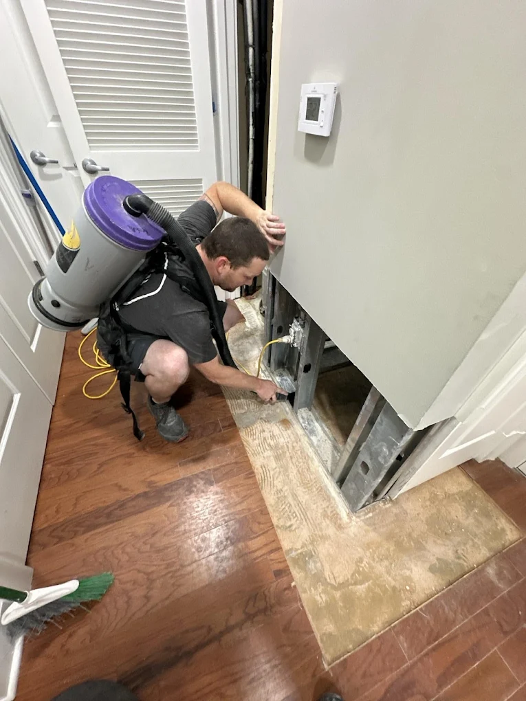 RestoPros worker fixing water damage