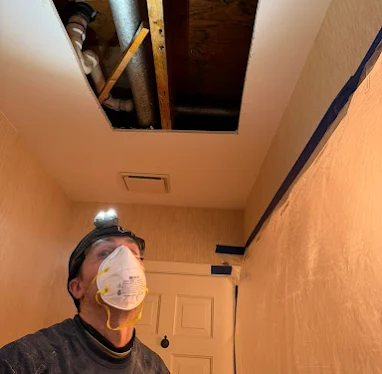 a member of the restopros team asseses damage to a New Lenox home