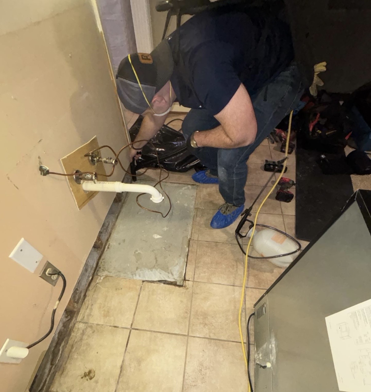 man fixing a pipe