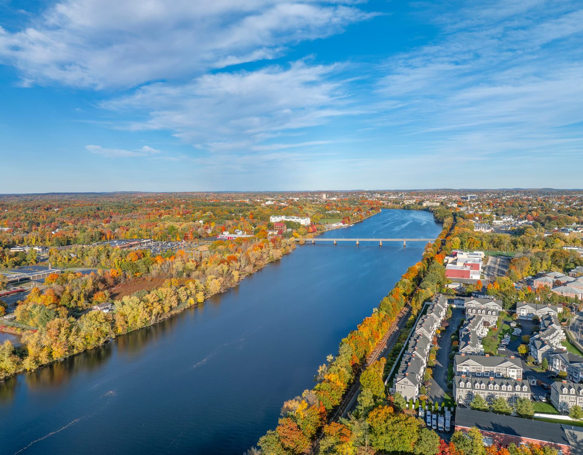 aerial view of Lowell cityscape in MA and river