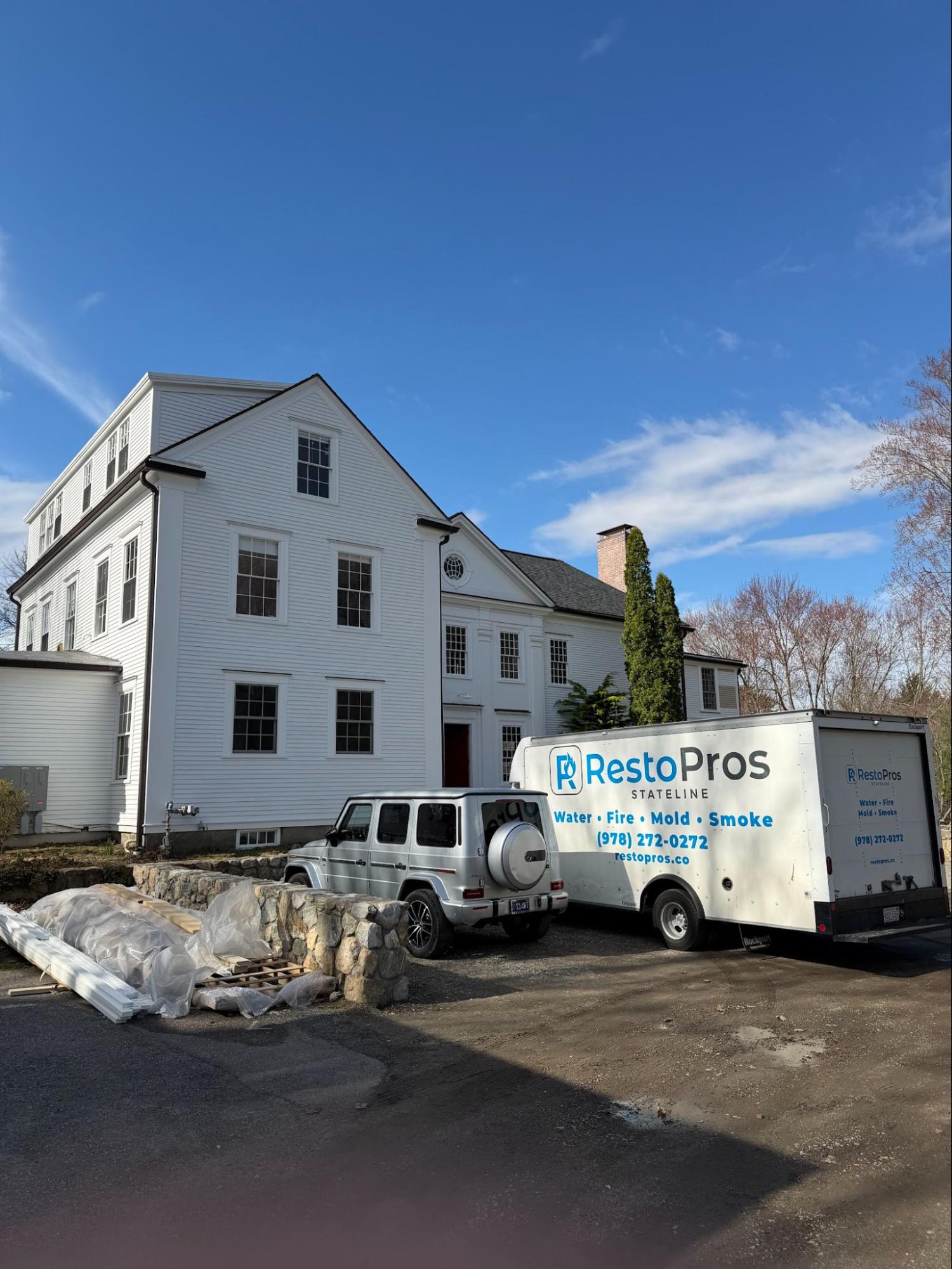 image of a home with a resto pros car in the front.
