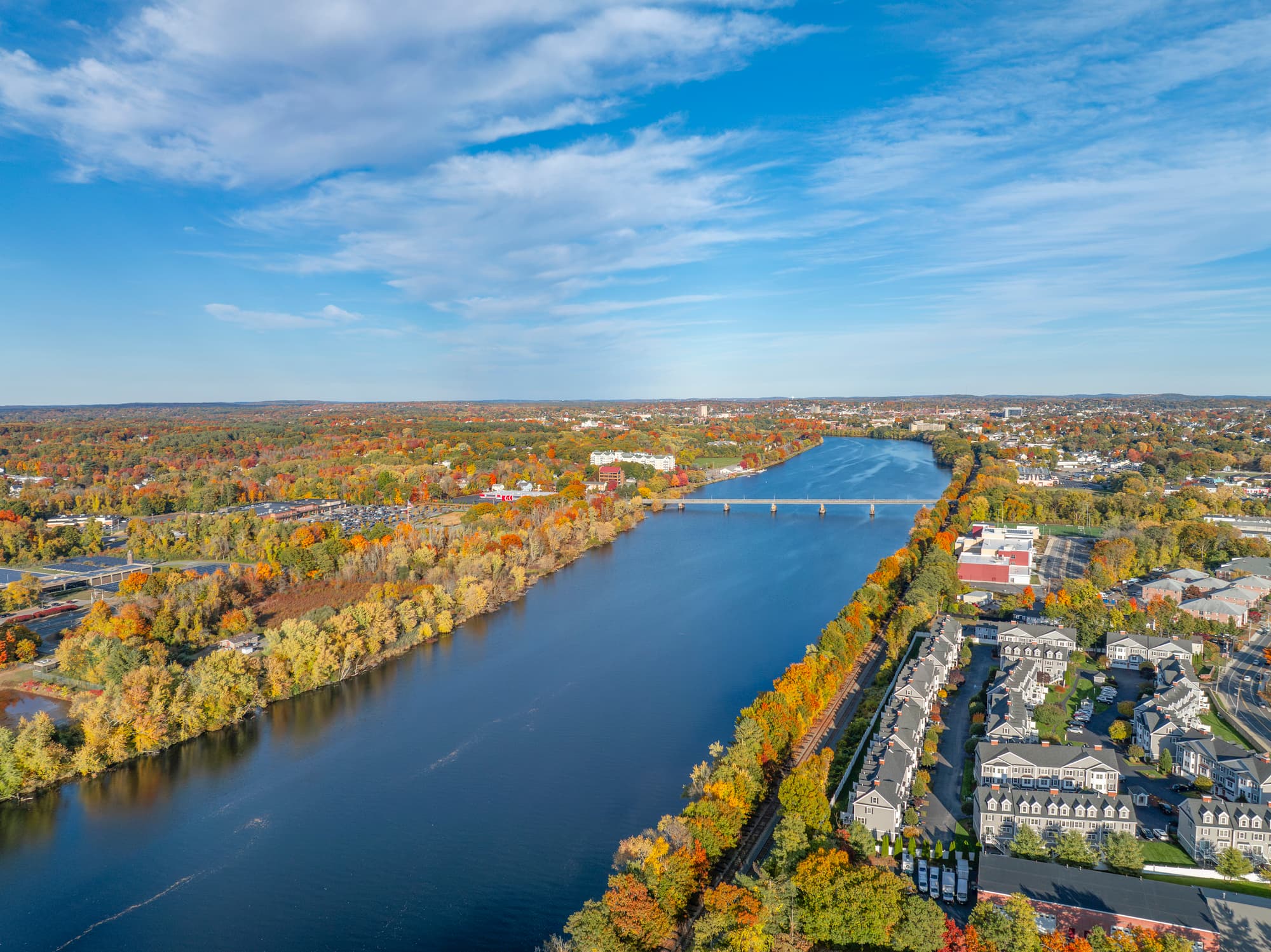 aerial view of Lowell cityscape in MA and river