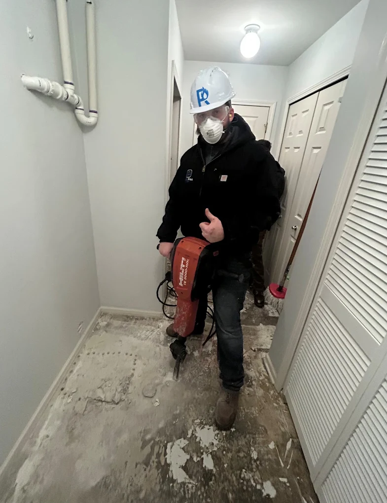 man working on water restoration