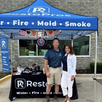 Dave and Jenni Bogdanski standing in front of a restopros image