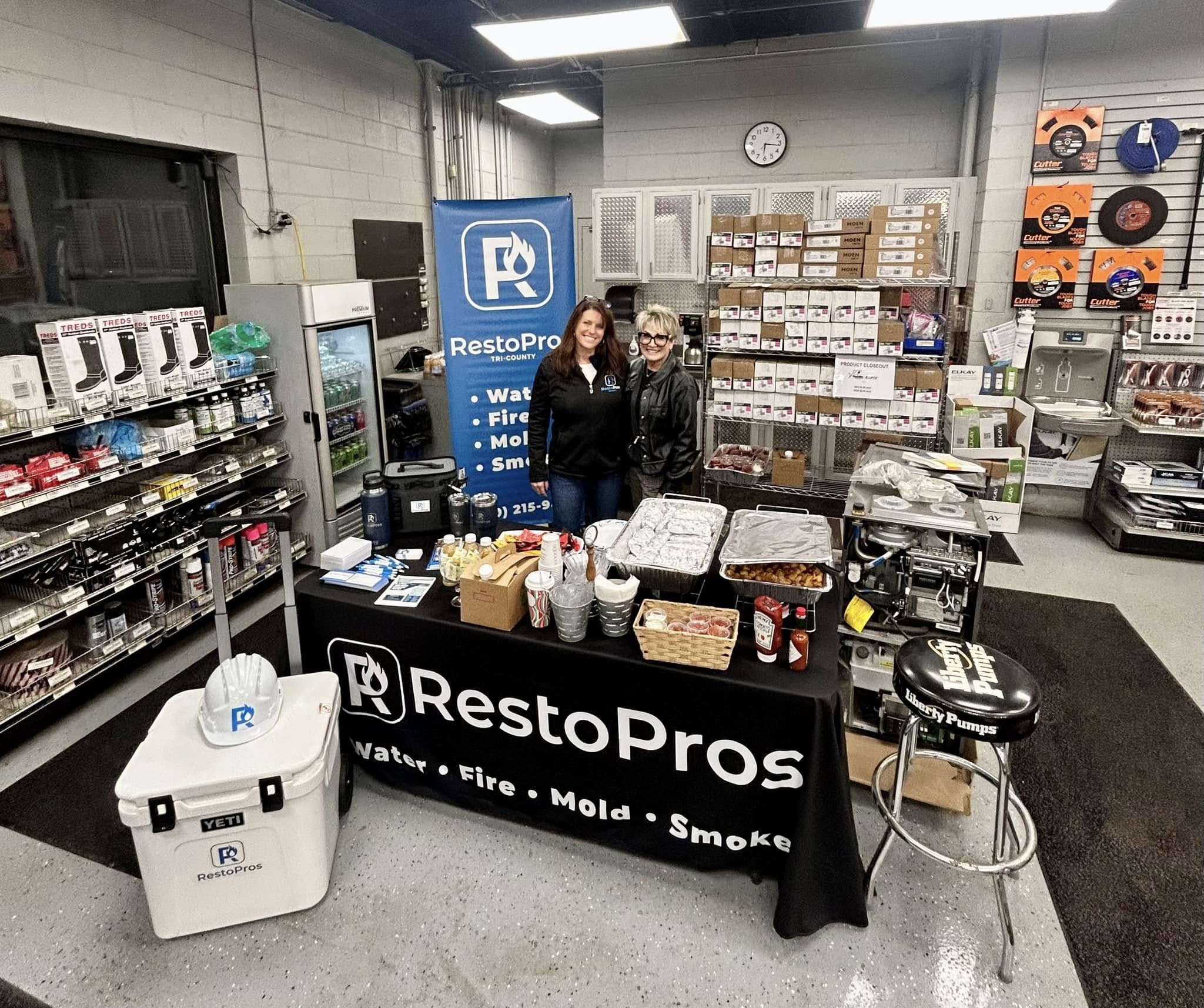 jenni and karen - restopros professionals at a tabling event