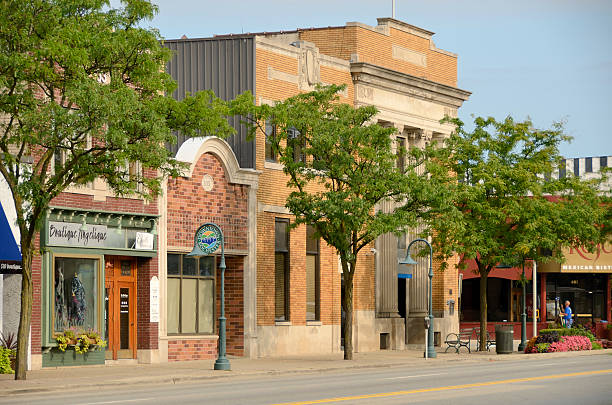 Rochester, Michigan, USA - August 25, 2011: The quaint downtown area of Rochester, Michigan with window washer working in the background. Rochester is a bedroom community of Detroit, Michigan, with many residents employed by the automotive industry. It has been named one of the best places to live by Money Magazine.