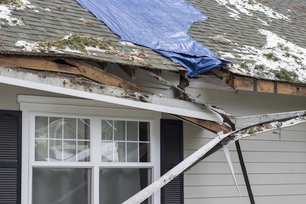 Storm damage on the roof of a house