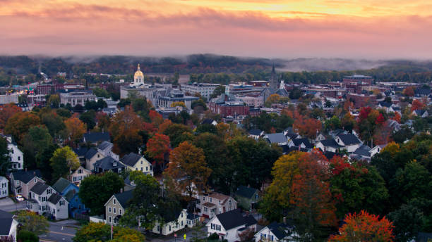 Aerial shots of the New Hampshire State House in Concord at sunrise on a misty morning in Fall.