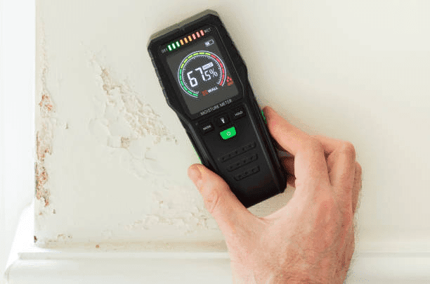 moisture meter on the wall checking wall moisture