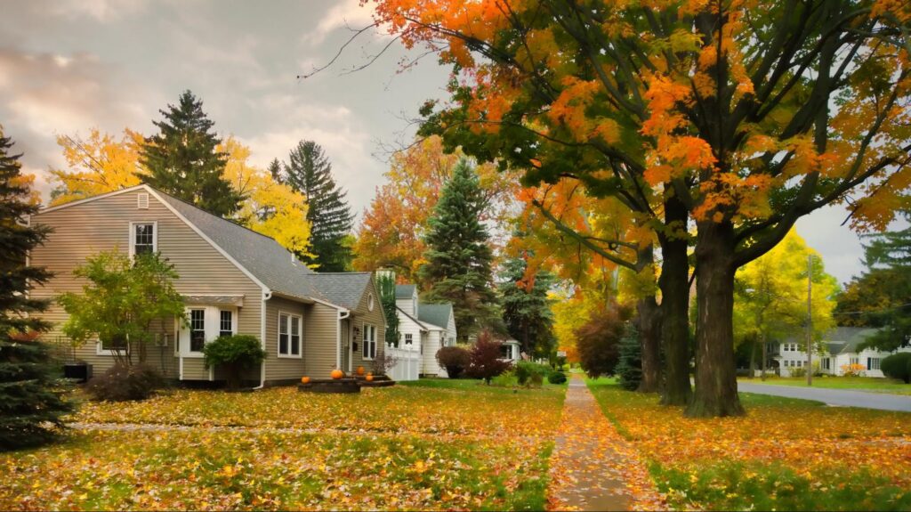 Fall neighborhood with falling leaves