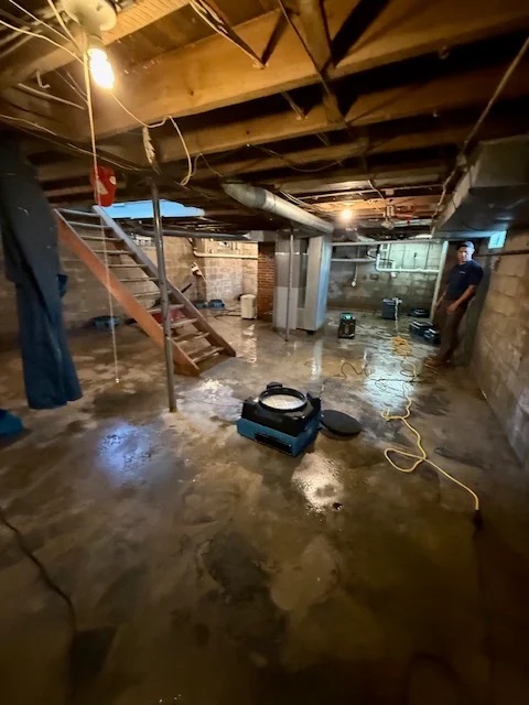 Basement in Akron undergoing water damage restoration