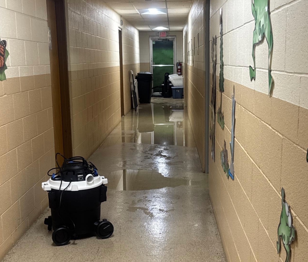 School hallway undergoing water damage restoration