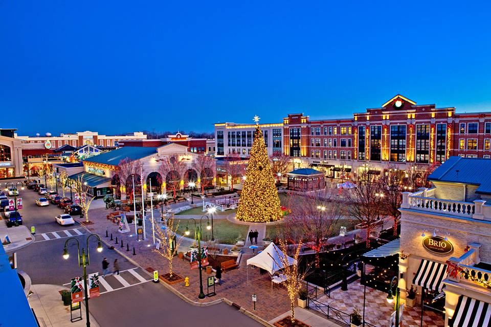 Beavercreek town center decorated for Christmas with a large lit tree and holiday lights.