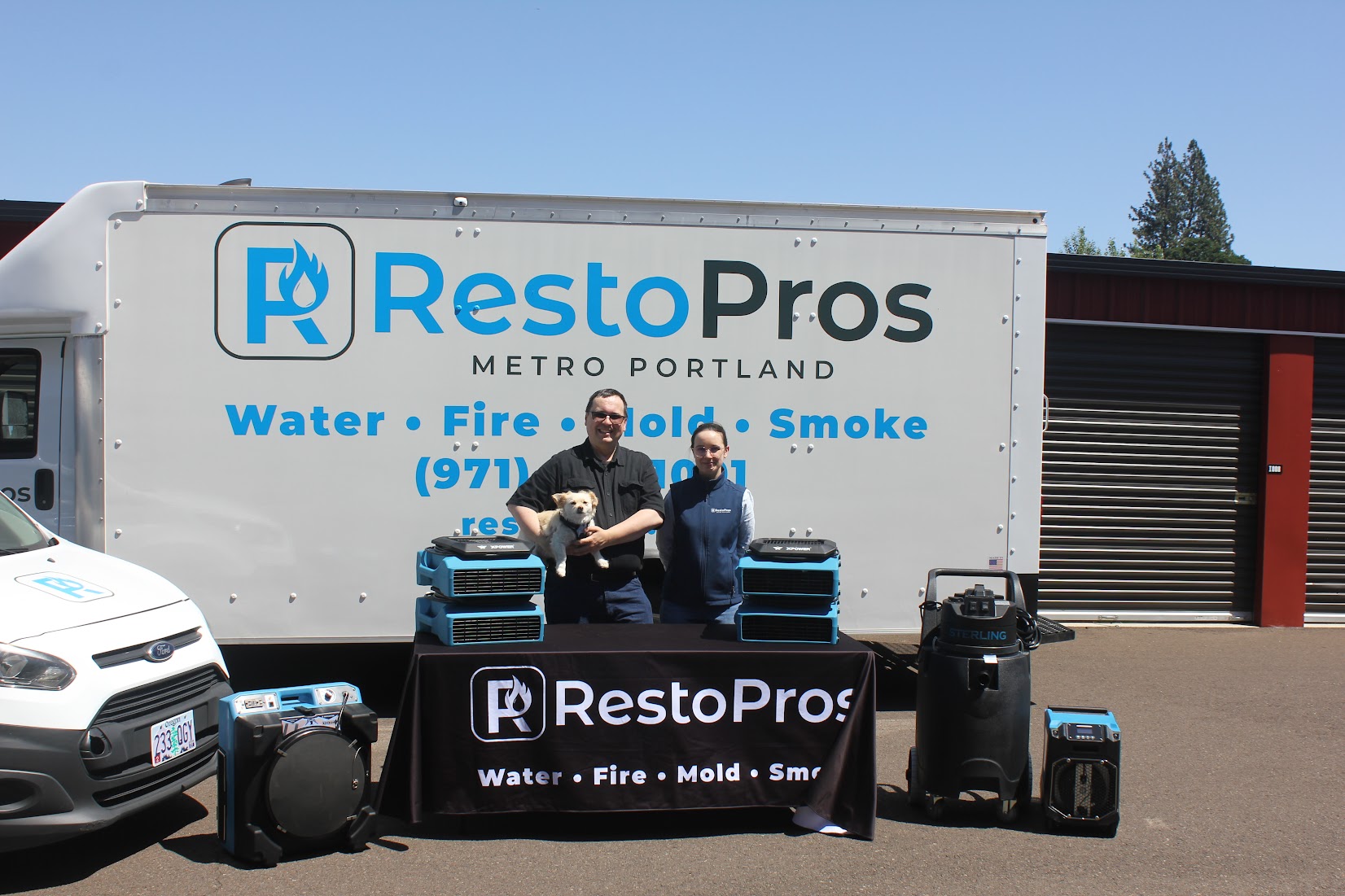 RestoPros team standing in front of truck