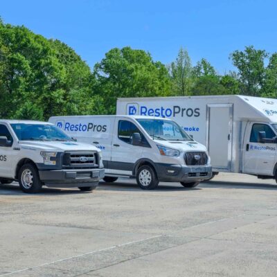 RestoPros work trucks parked image