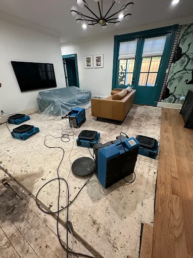 Fans on floor for water damage restoration