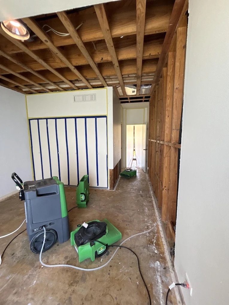 Room undergoing water damage remediation