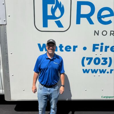 Owner of RestoPros Northern Virginia standing in front of his truck