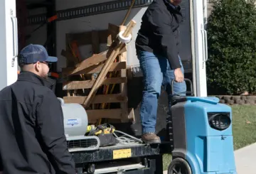 two men unloading a truck