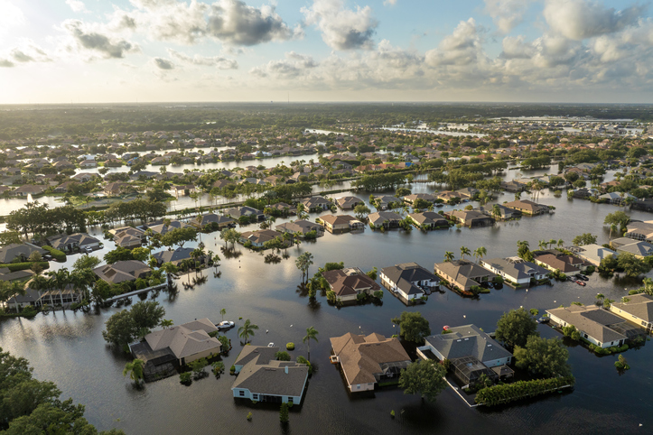 Flooding in Florida caused by tropical storm from hurricane Debby. Suburb houses in Laurel Meadows residential community surrounded by flood waters in Sarasota. Aftermath of natural disaster.