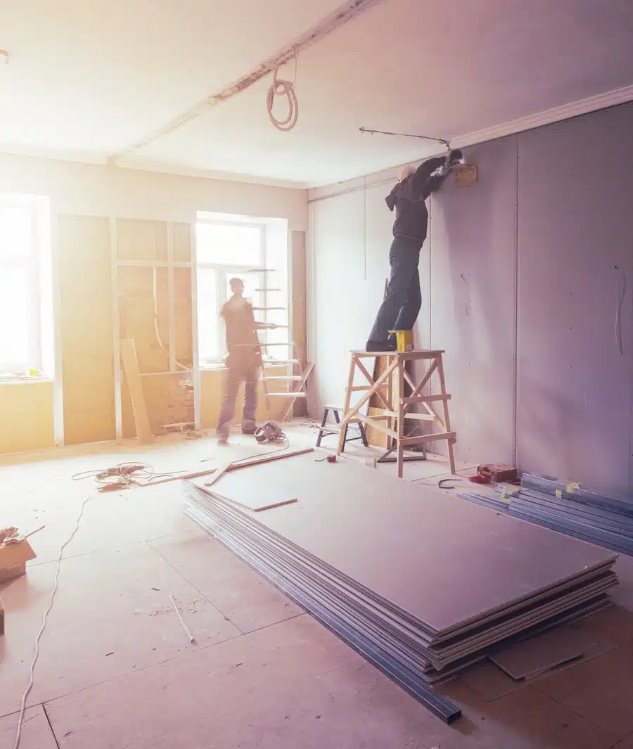 Workers are installing plasterboard